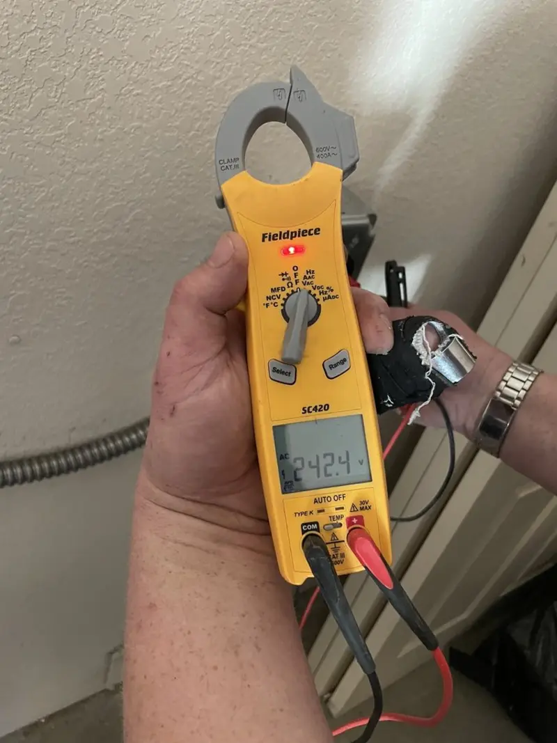 Voltage testing with clamp meter during Outlet Installation in Pinellas Park